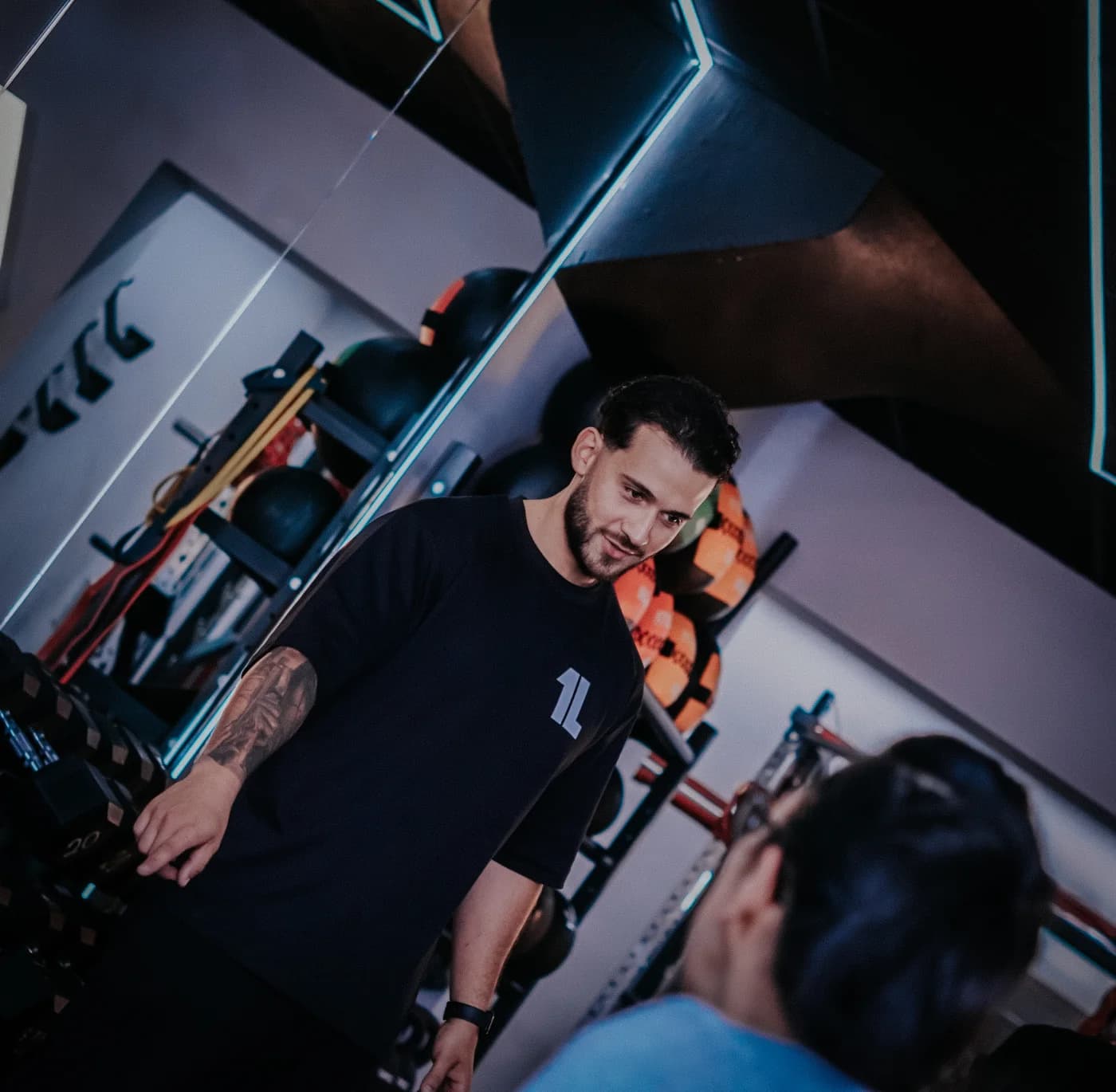 One Level Fitness founder and coach on the training floor